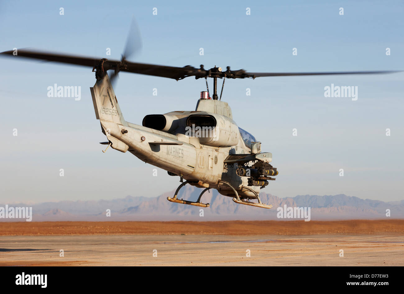 United States Marine Corps AH-1W SuperCobra attack helicopter launches on combat operation in Helmand Province Afghanistan Stock Photo