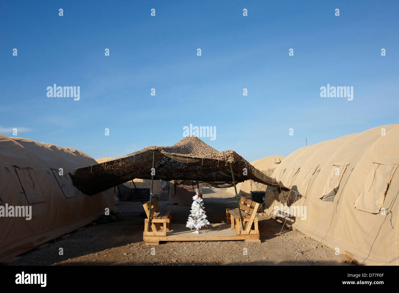 Christmas tree amid military tents Camp Leatherneck Helmand Province Afghanistan Stock Photo