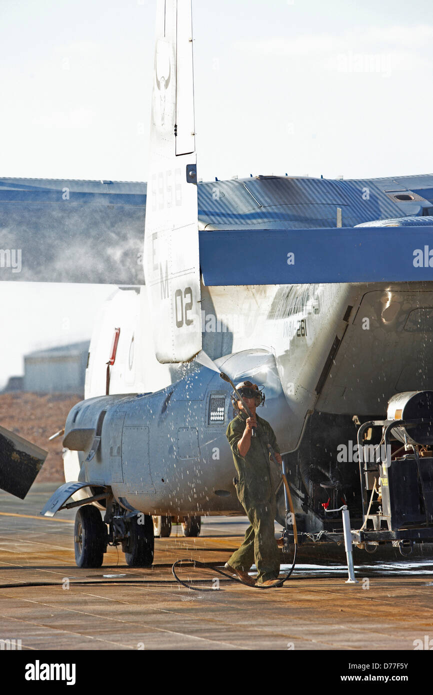 United States Marine aircraft maintenance specialist pressure washing MV-22 Osprey Camp Bastion Helmand Province Afghanistan Stock Photo