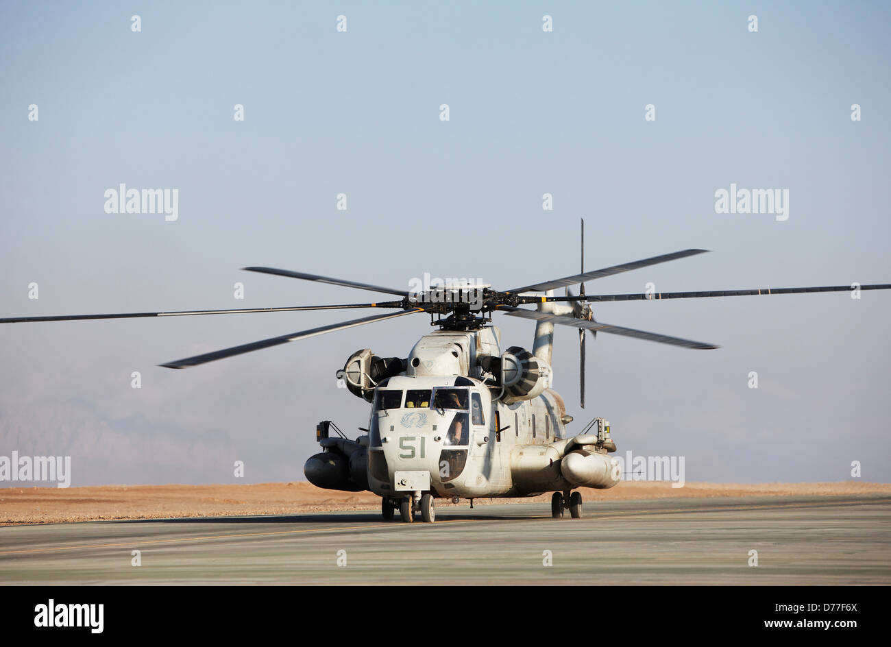 United States Marine Corps CH-53D Sea Stallion heavy lift transport helicopter taxis along flight line Camp Bastion Helmand Stock Photo