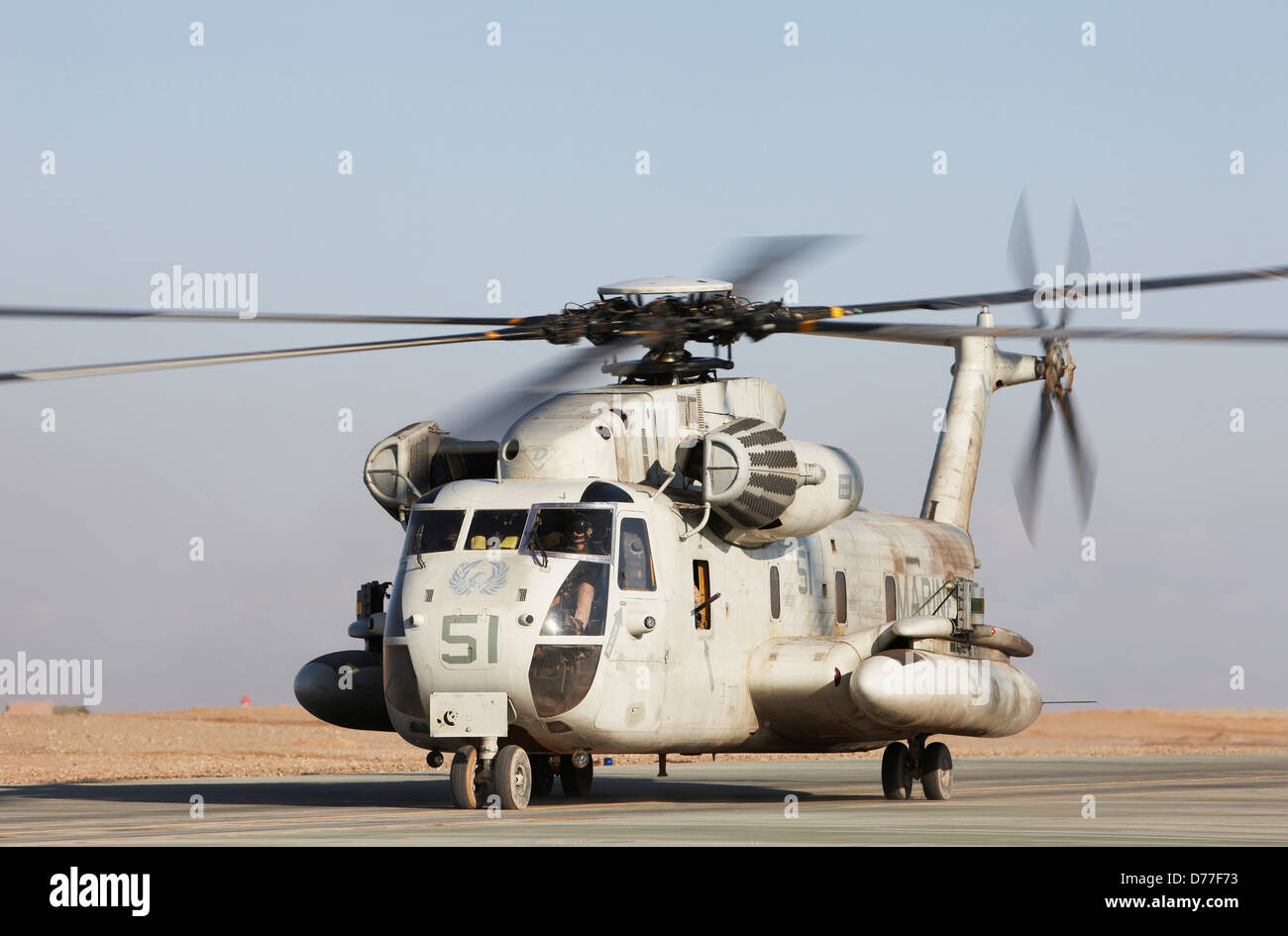 United States Marine Corps CH-53D Sea Stallion heavy lift transport helicopter taxis along flight line Camp Bastion Helmand Stock Photo