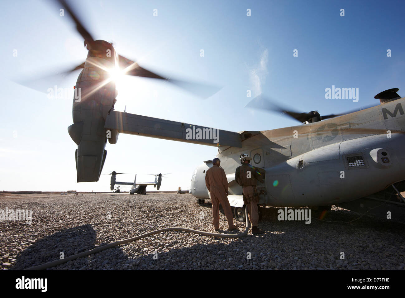 United States Marines refuel MV-22 Osprey at remote austere combat outpost in Helmand Province Afghanistan Stock Photo