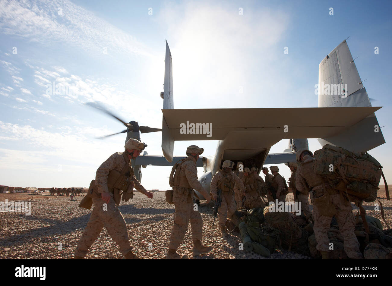 United States Marines load into MV-22 Osprey at remote austere combat outpost in Helmand Province Afghanistan Stock Photo