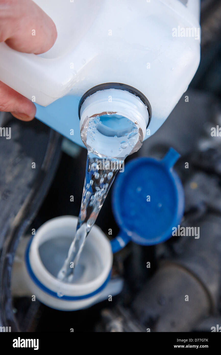 filling windscreen windshield washer reservoir in a car engine