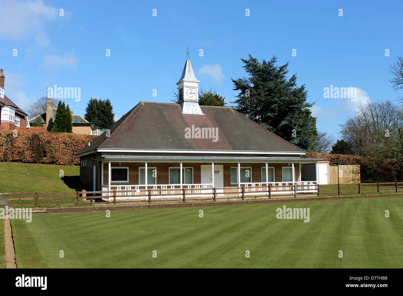 Scenic view of English bowling green and pavilion with clock tower. Stock Photo