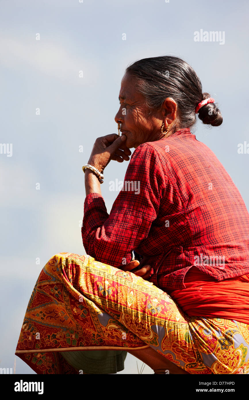 Nepal Himalaya Side view elderly Nepalese woman contemplating Stock