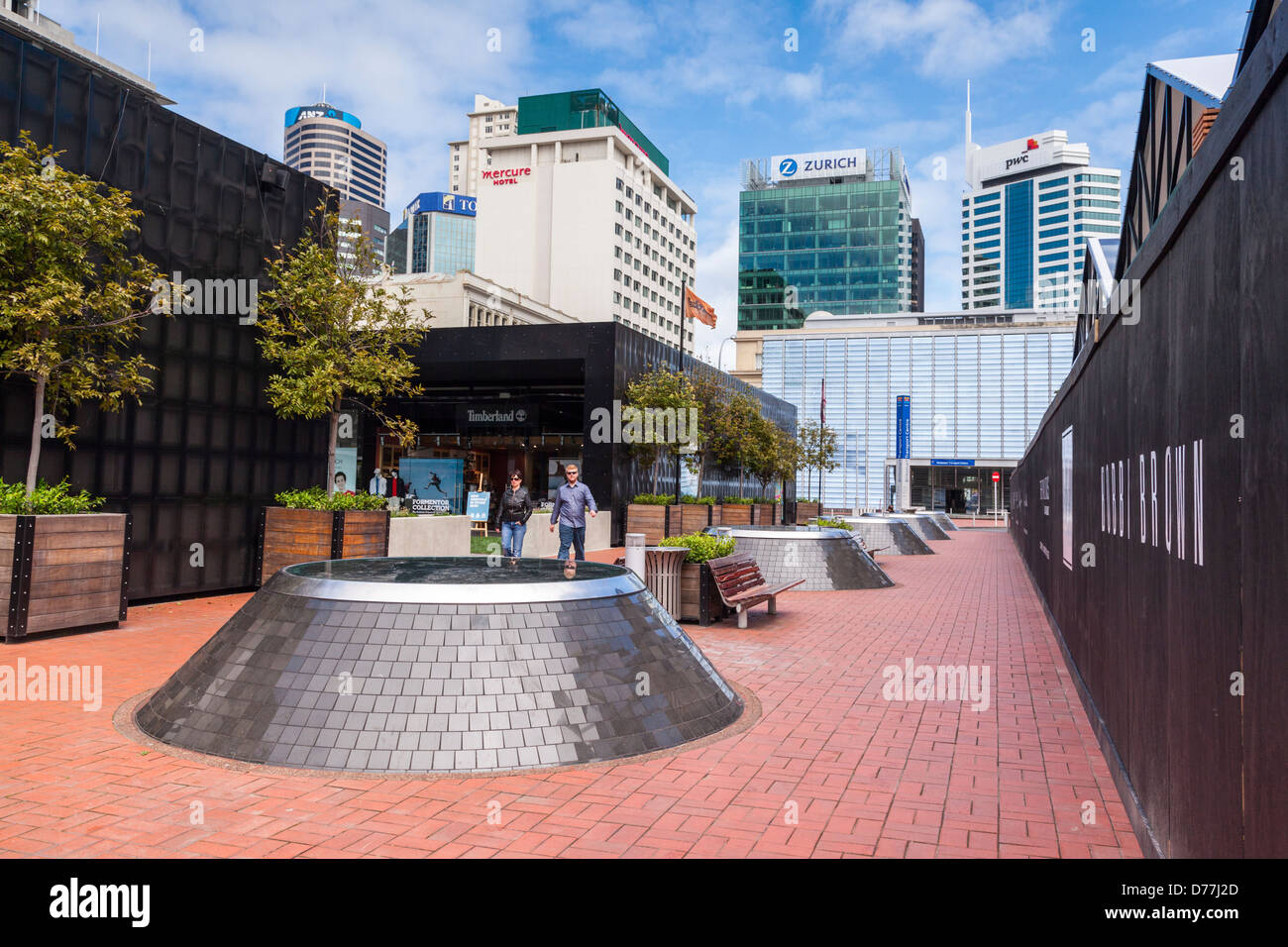 Street scene,downtown, Auckland CBD. The raised areas look down into Britomart Station, which can be seen in the background. Stock Photo