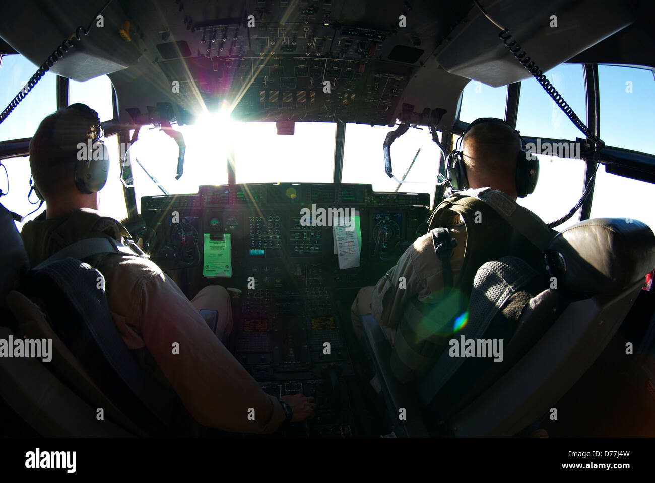 Cockpit view US Marine Corps aviators flying KC-130J Super Hercules over western Iraq during combat operation Stock Photo