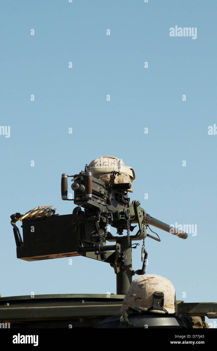 Kevlar helmet rests atop M2 .50 caliber machine gun Stock Photo