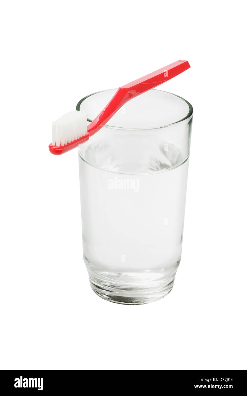 Toothbrush And A Glass Of Water On White Background Stock Photo