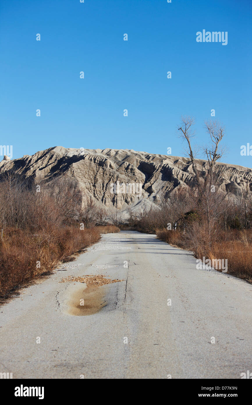 USA Oklahoma Picher Empty deserted road leading to chat pile toxic byproduct underground mining