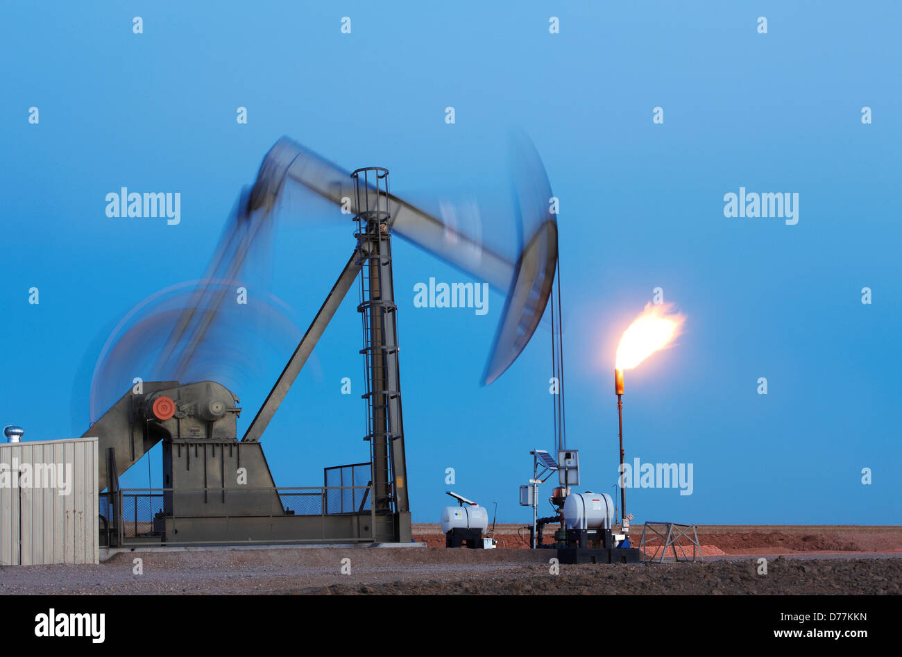 Oil well pumpjack pump jack gas flare flare stack eastern plains Colorado Oil well developed hydraulic fracturing also known as Stock Photo