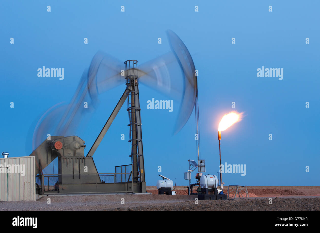Oil well pumpjack pump jack gas flare flare stack eastern plains Colorado Oil well developed hydraulic fracturing also known as Stock Photo