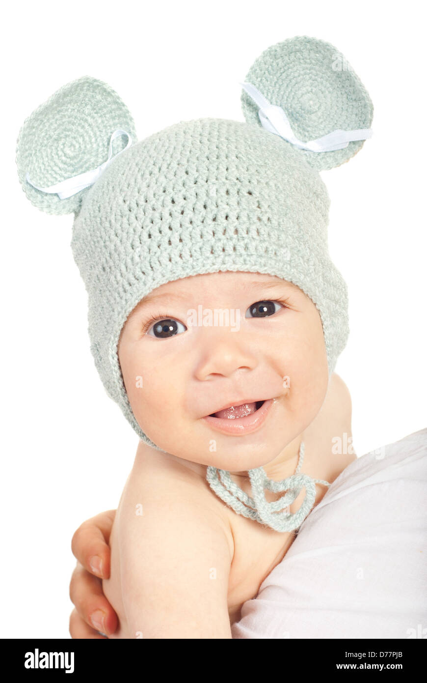 Smiling baby boy in knitted mouse cap isolated on white background Stock Photo
