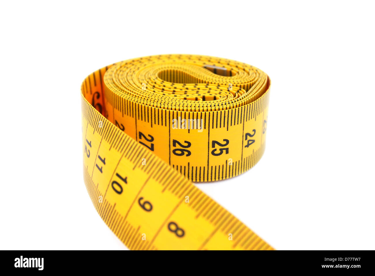 Yellow measuretape isolated on white background Stock Photo - Alamy