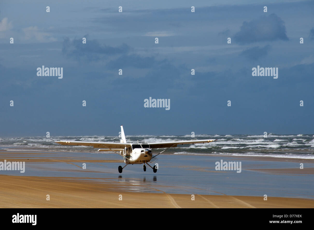 Plane taking off on Seventy Five Mile Beach Fraser Island Queensland Australia Stock Photo