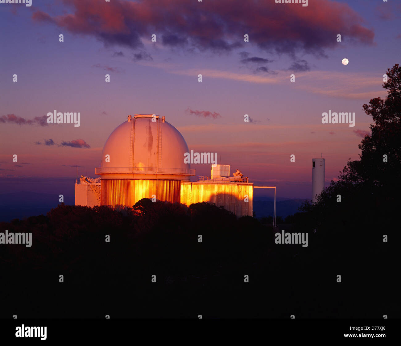 Moon rising above Kitt Peak as last rays setting sun illuminate 2.1