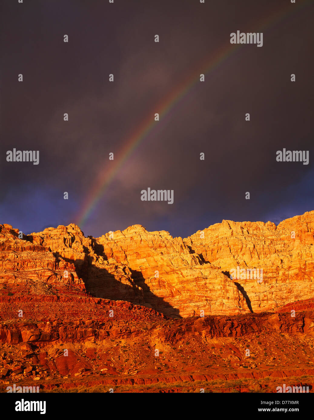 Departing storm rainbow over Echo Cliffs near Cedar Ridge Navajo Reservation Arizona. Stock Photo