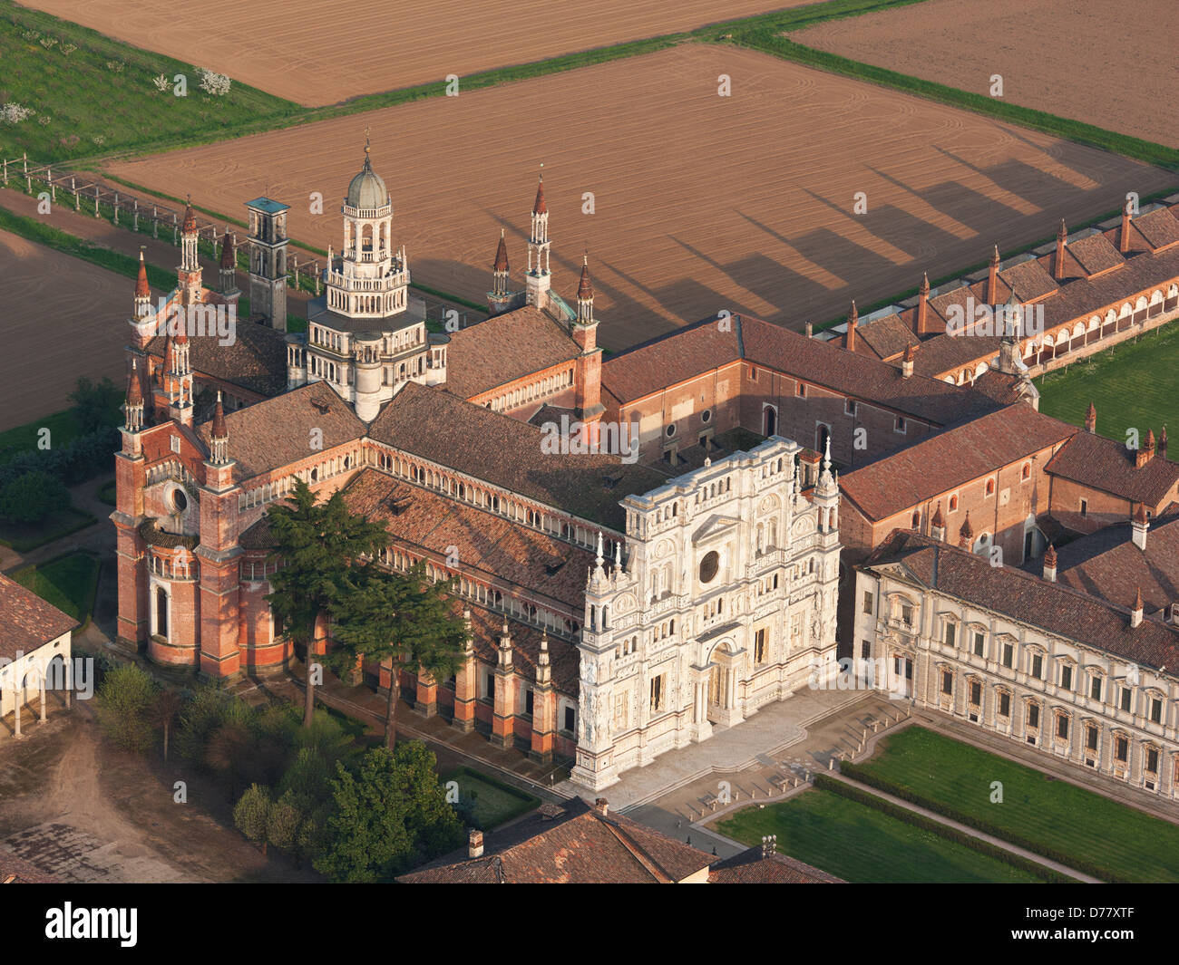AERIAL VIEW. Carthusian monastery south of Milan, in the Po Valley. Certosa di Pavia, Province of Pavia, Lombardy, Italy. Stock Photo