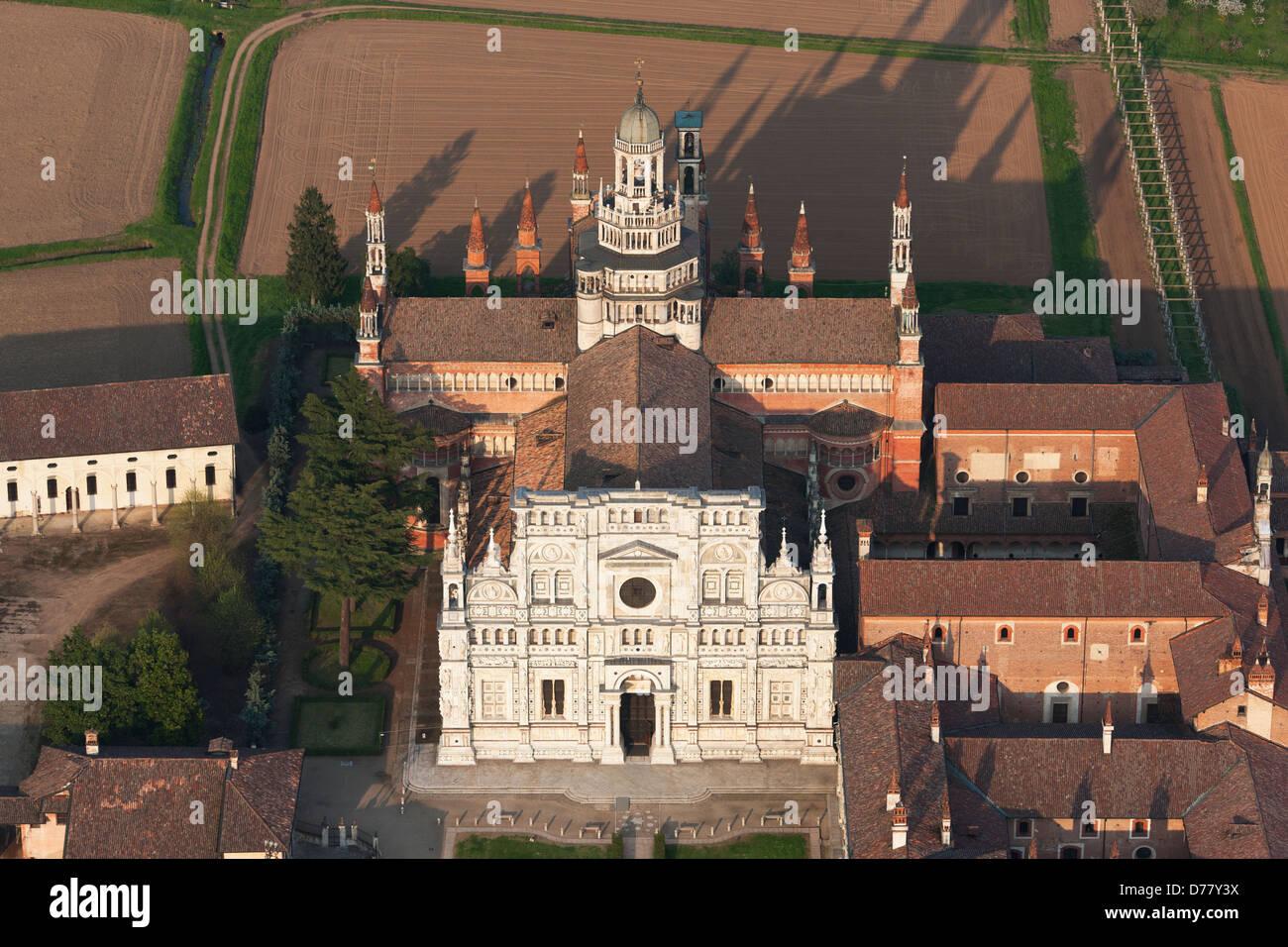 AERIAL VIEW. Carthusian monastery south of Milan, in the Po Valley. Certosa di Pavia, Province of Pavia, Lombardy, Italy. Stock Photo