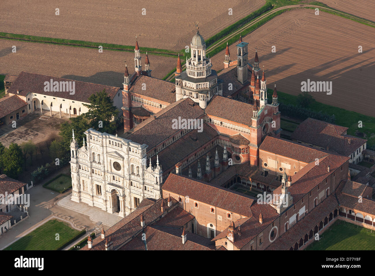AERIAL VIEW. Carthusian monastery south of Milan, in the Po Valley. Certosa di Pavia, Province of Pavia, Lombardy, Italy. Stock Photo