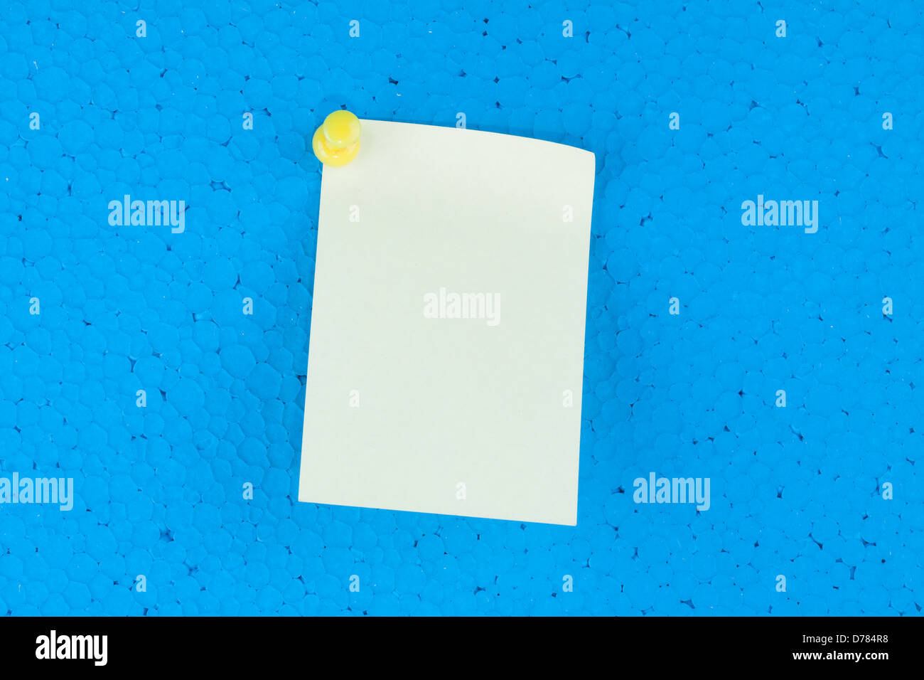yellow sticky with blue background and space for text Stock Photo