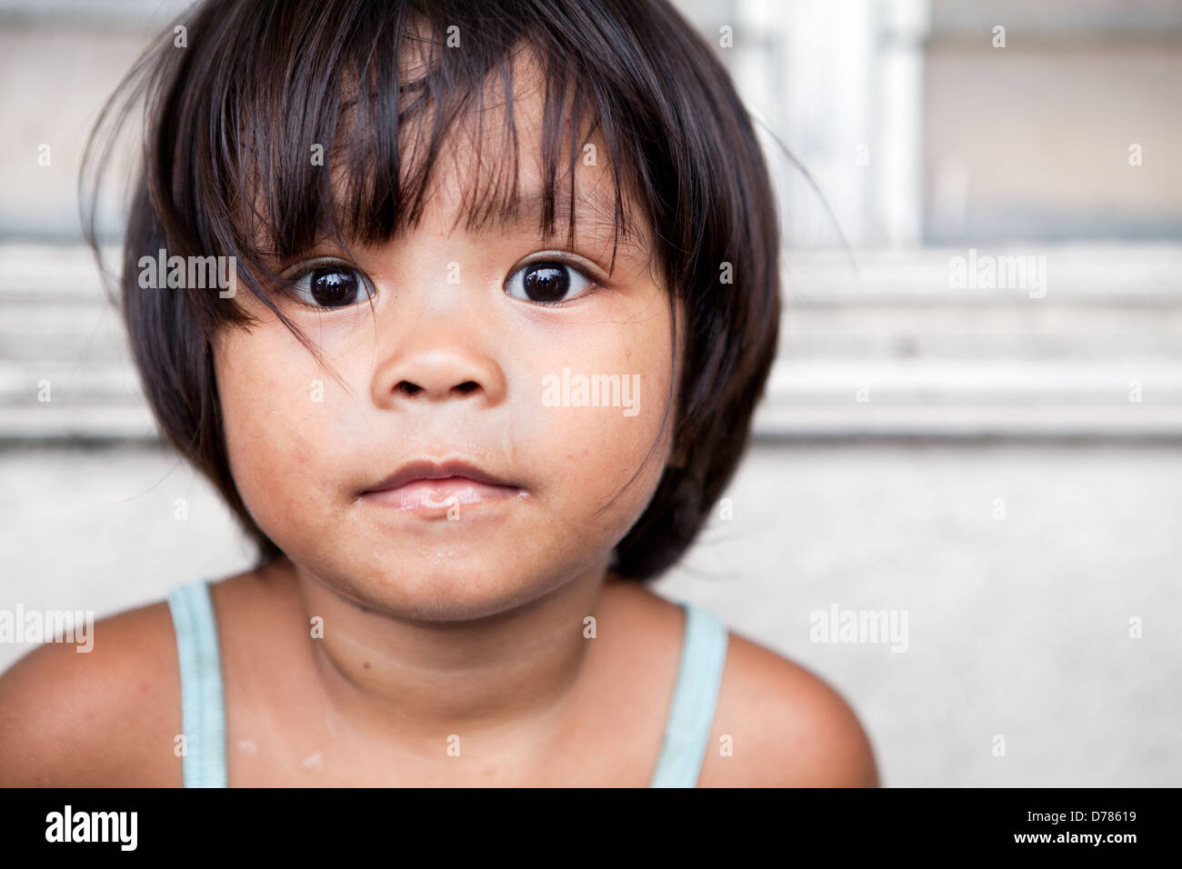 Young girl portrait in the Philippines. Filipina child living in poverty. Stock Photo