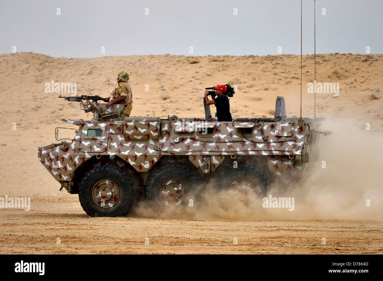 Qatar Armed Forces soldiers patrol in an armored vehicle during a joint counter-terrorism exercise with US Forces April 28, 2013 in Zikrit, Qatar. Stock Photo