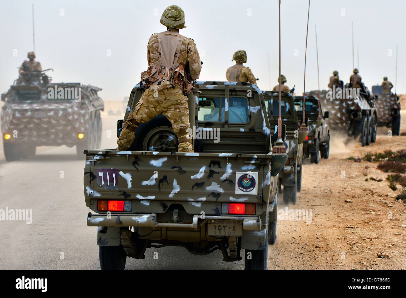 Qatar Armed Forces soldiers ride out in a convoy during a joint counter-terrorism exercise with US Forces April 28, 2013 in Zikrit, Qatar. Stock Photo