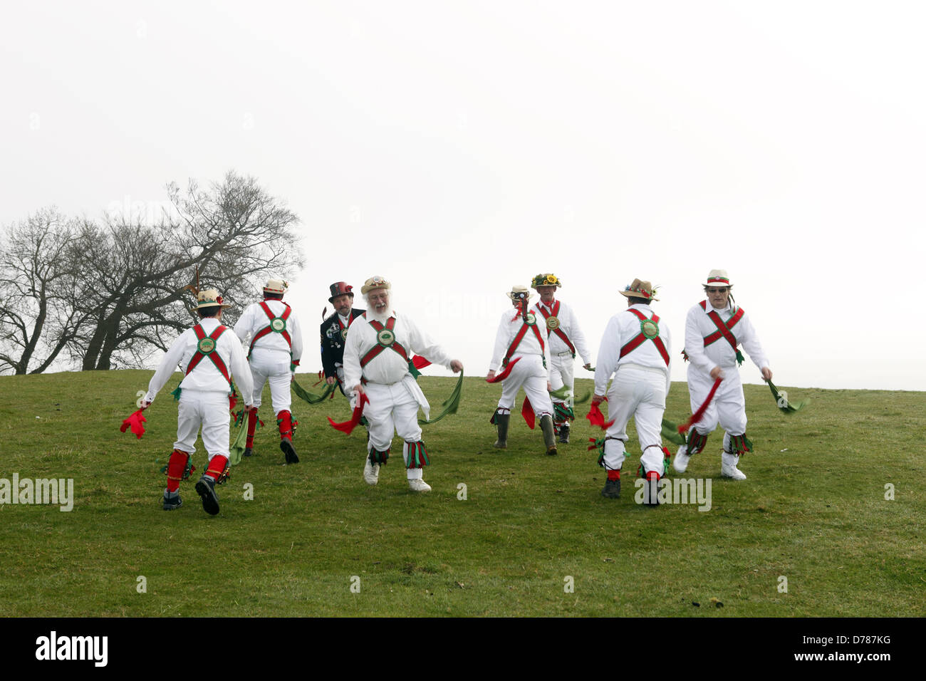 Chanctonbury Ring Morris Men celebrate May Day (1st May) with their traditional singing and dancing at Chanctonbury Ring, atop Chanctonbury Hill, East Sussex. Stock Photo