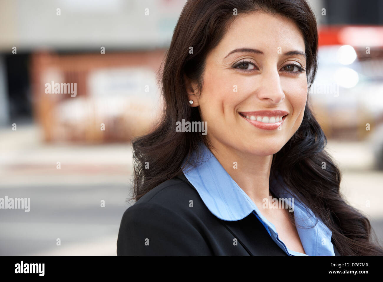 Portrait Of Businesswoman Standing In Street Stock Photo