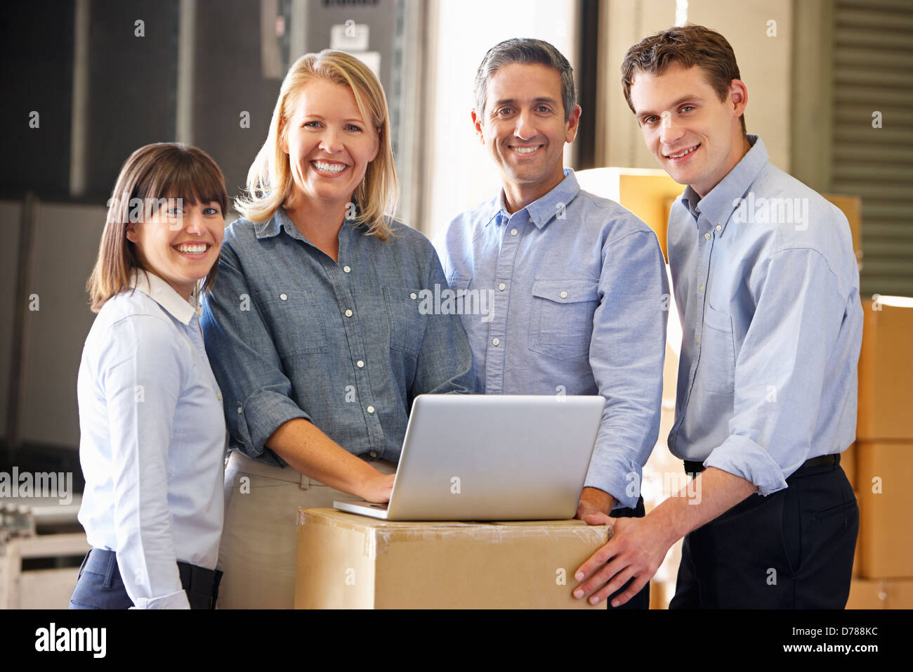 Portrait Of Workers In Distribution Warehouse Stock Photo