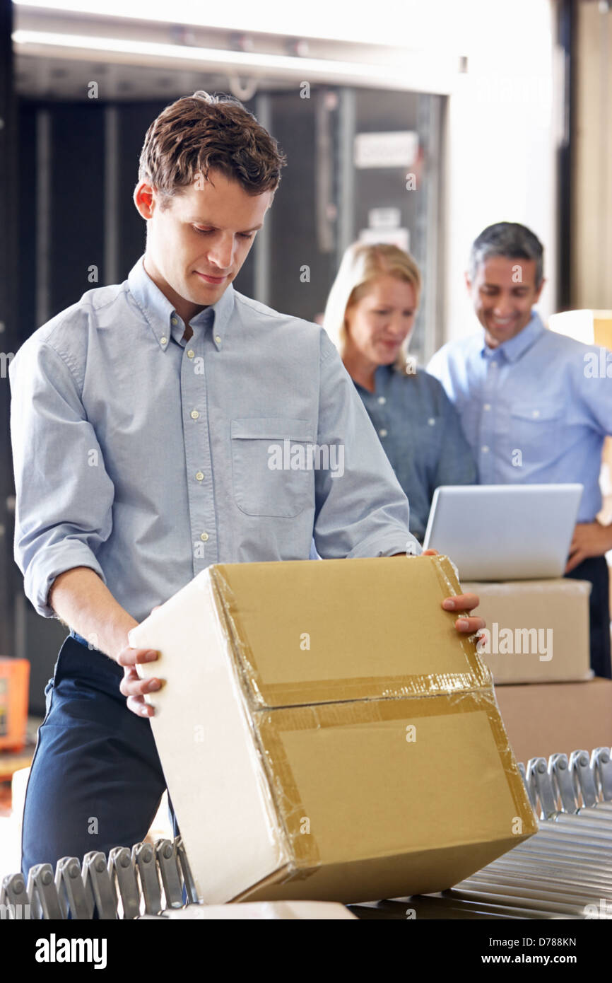 Workers In Distribution Warehouse Stock Photo