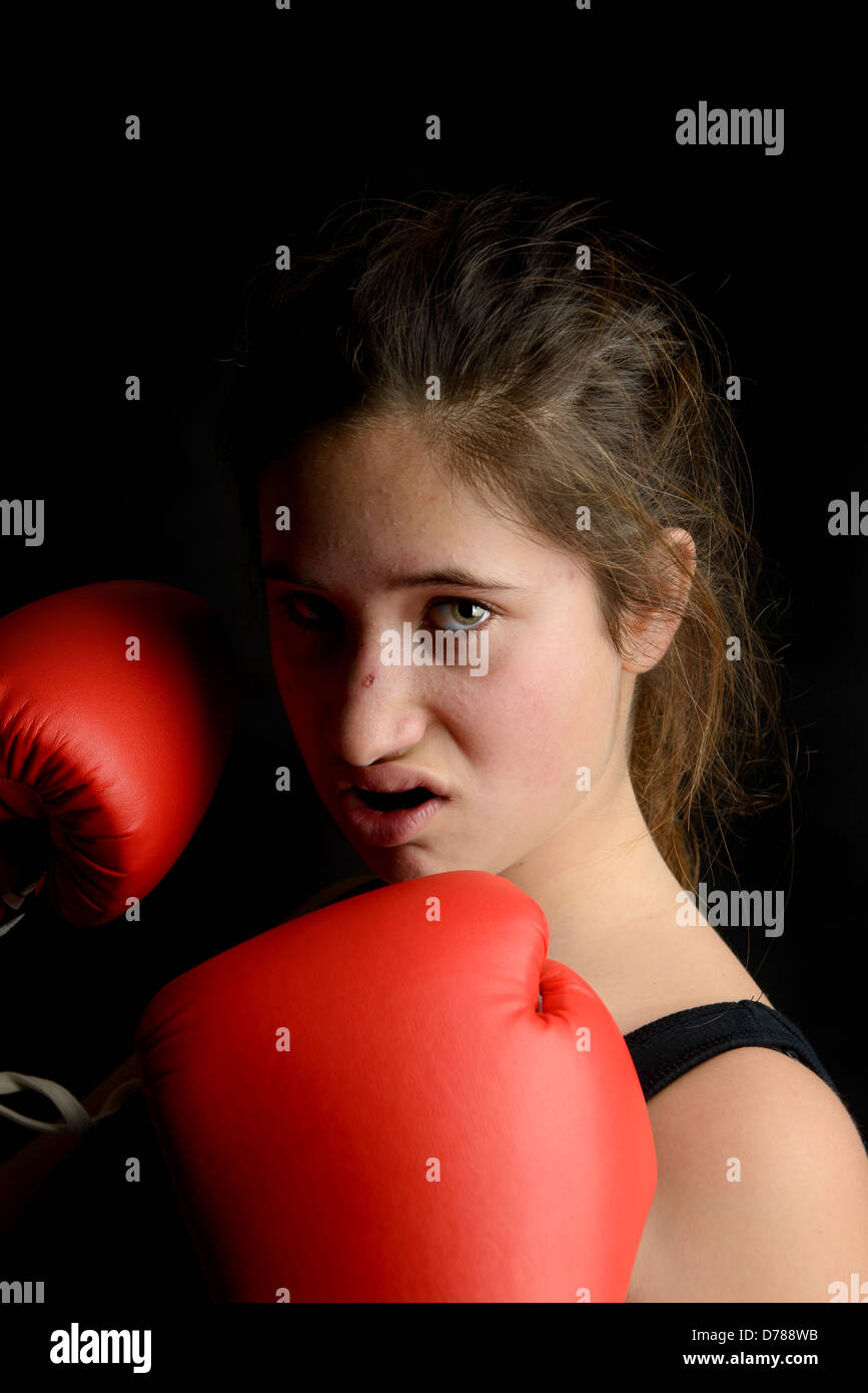Young girl boxer posing with gloves Stock Photo Alamy