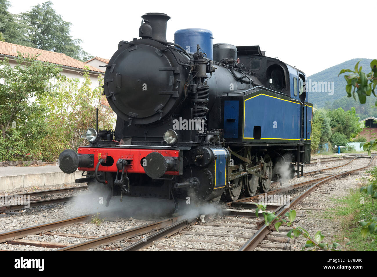 Henschel 040T 2524 steam locomotive approaching station at St Jean du Gard in the Gard (30) departement of France.