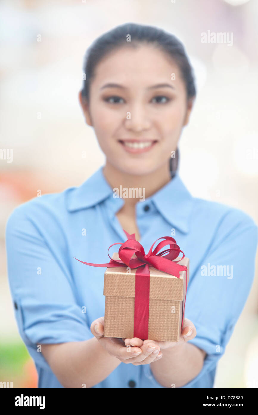 Young Woman Holding Gift Box Stock Photo