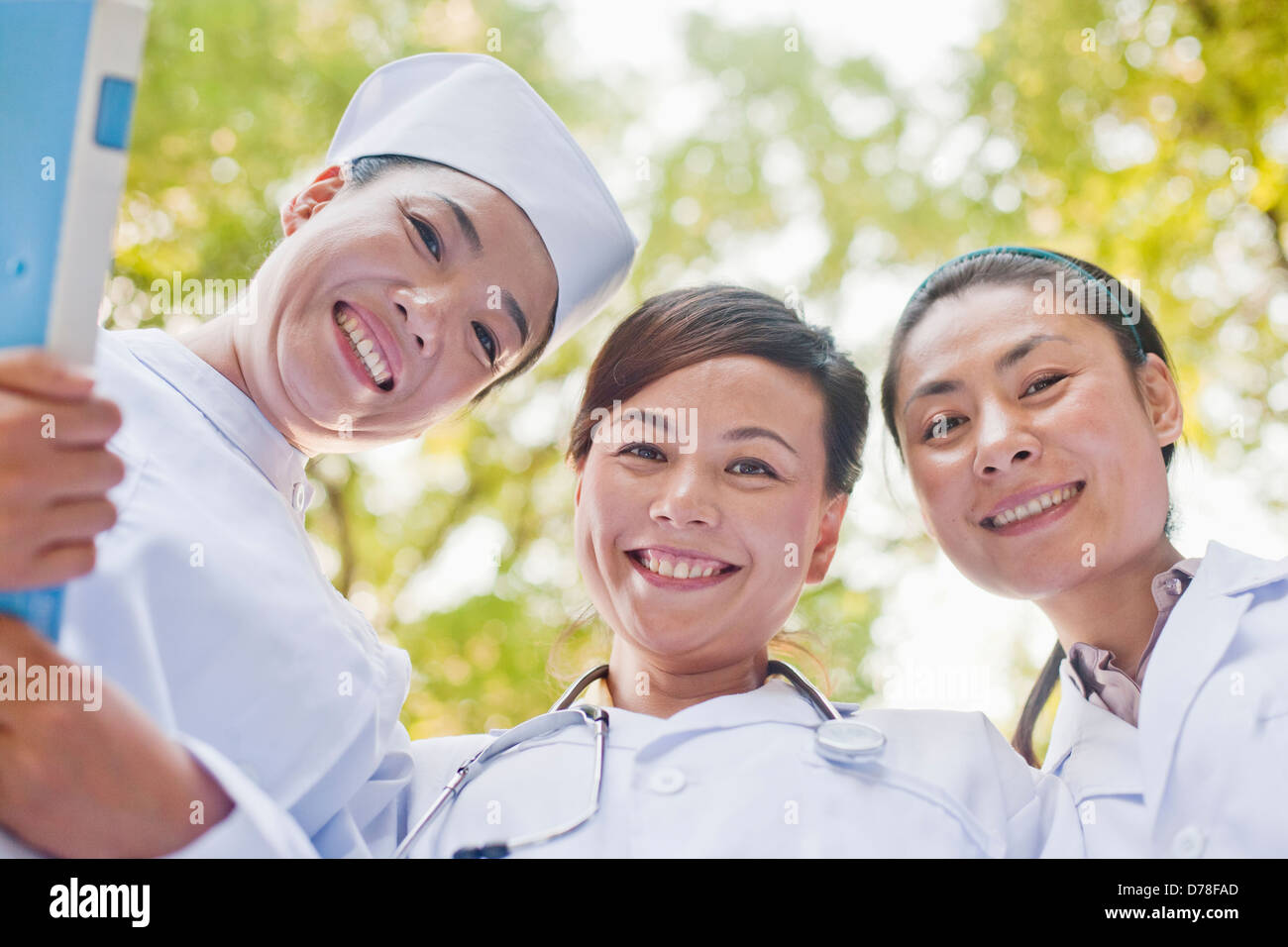 Three Doctors Looking Down at Camera Stock Photo - Alamy