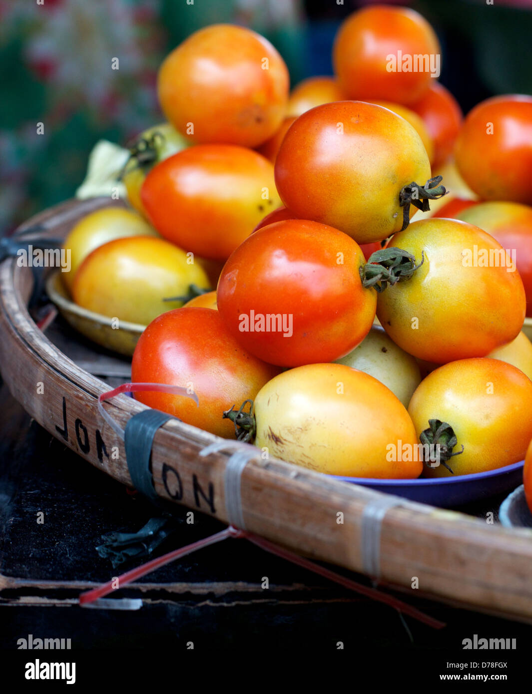 Organic tomatoes in basket at local market in Manila Stock Photo - Alamy