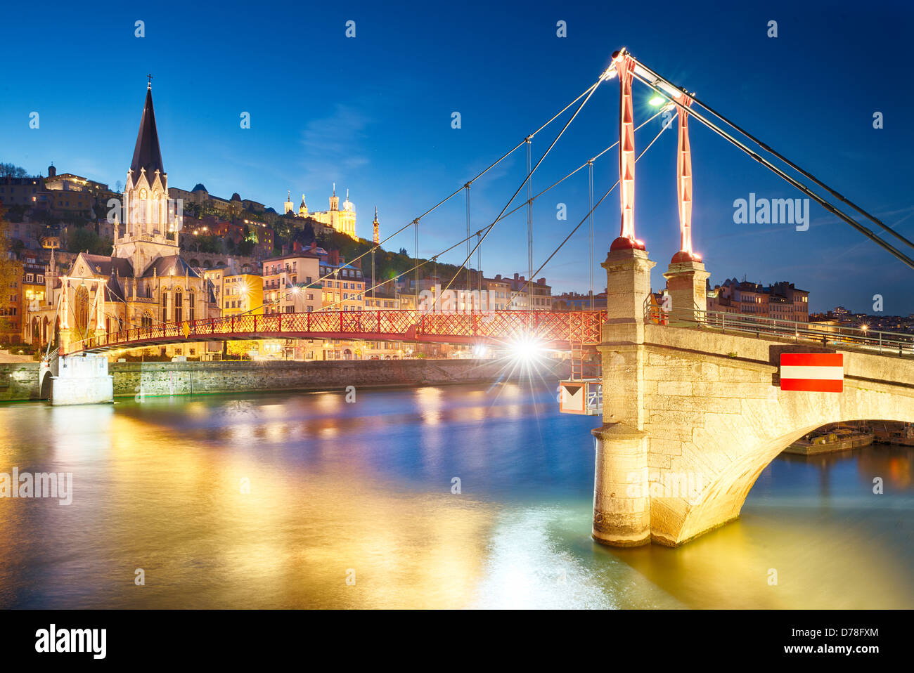 night view from St Georges footbridge in Lyon city with Fourviere cathedral, France Stock Photo