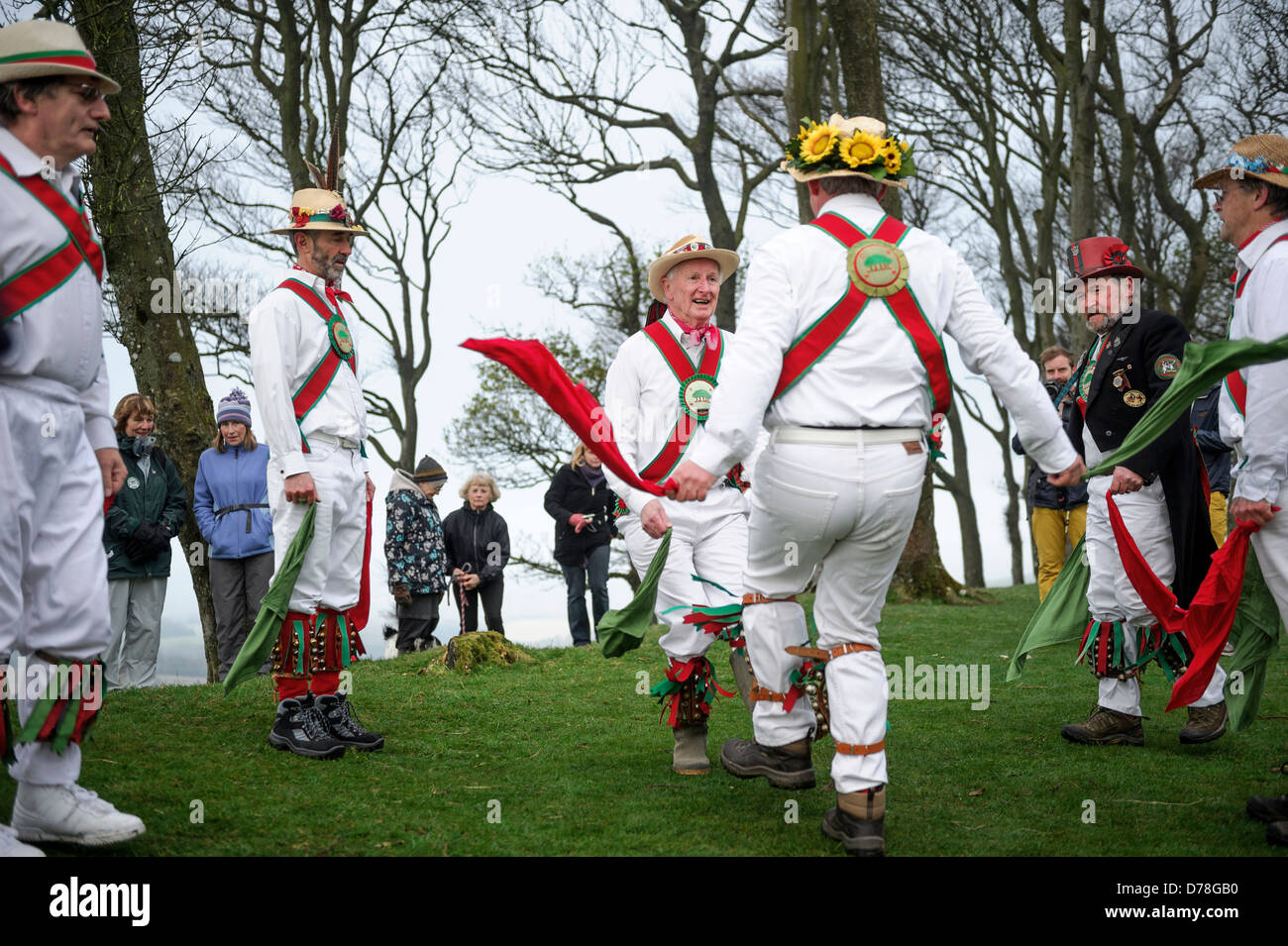 The Chanctonbury Ring Morris men welcome in Spring on May 1 2013 atop a cold Chanctonbury Hill on the Sussex South Downs UK Stock Photo
