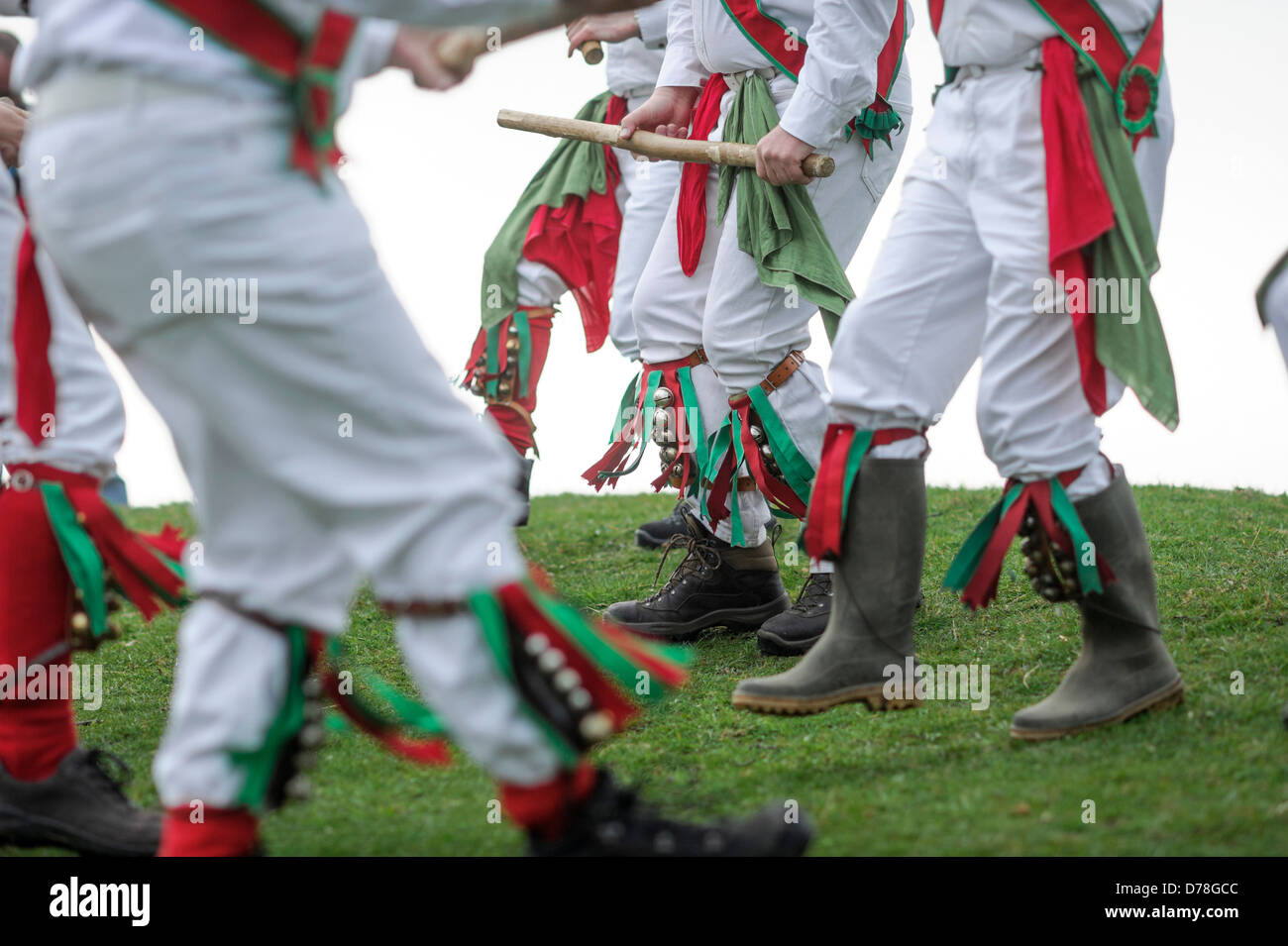 The Chanctonbury Ring Morris men welcome in Spring on May 1 2013 atop a cold Chanctonbury Hill on the Sussex South Downs UK Stock Photo