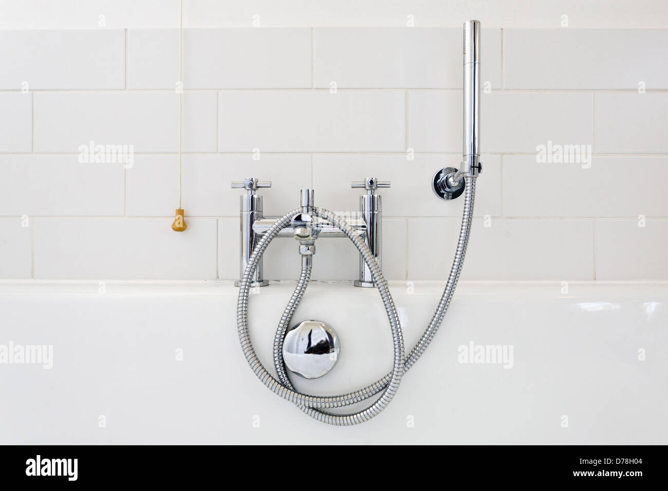 Modern bath taps and shower attachment Stock Photo