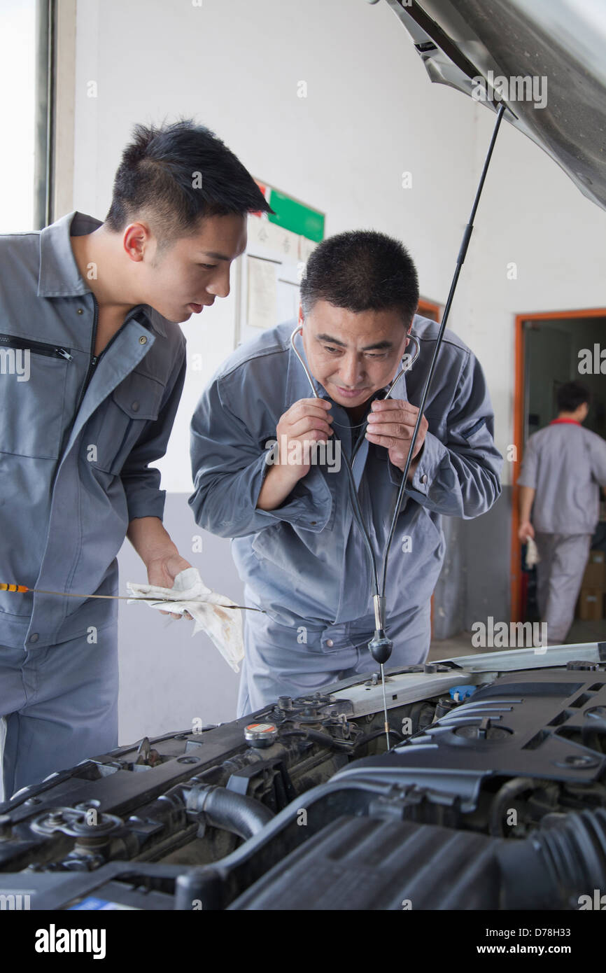 Mechanic listening engine hi-res stock photography and images - Alamy