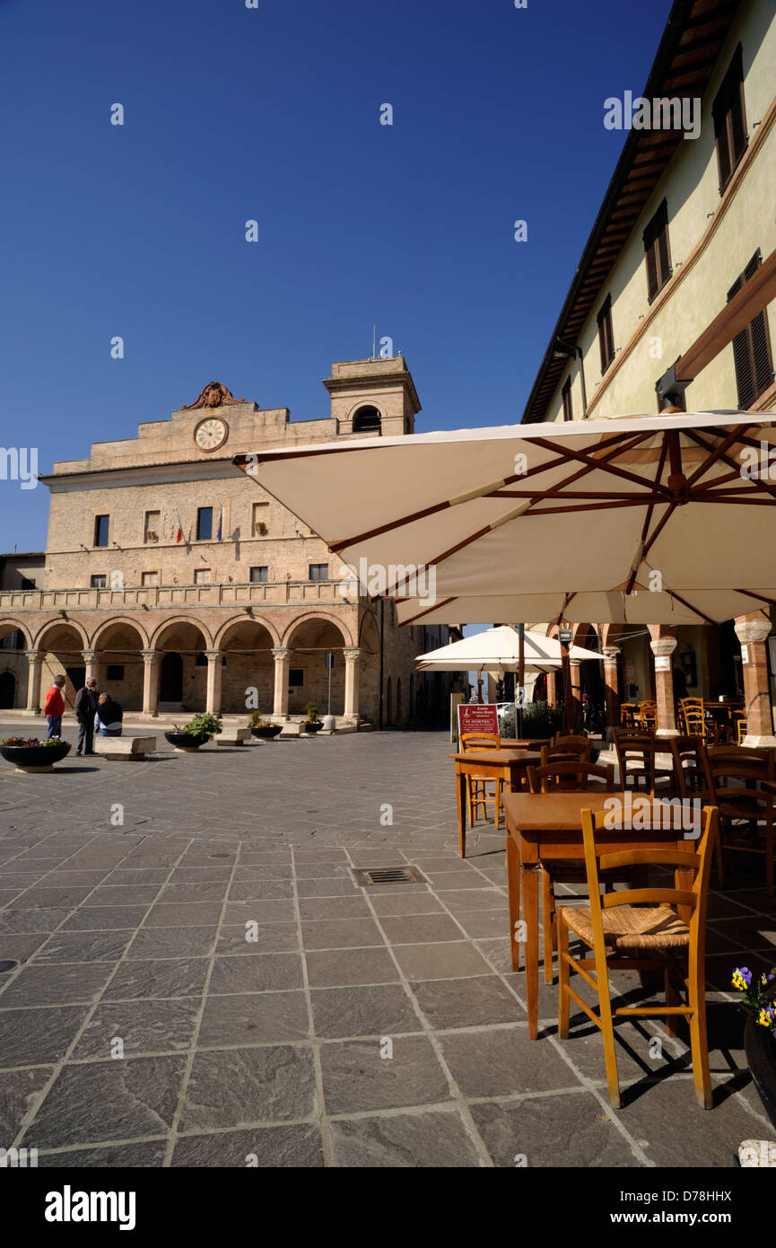 italy, umbria, montefalco, piazza del comune, townhall and restaurants Stock Photo