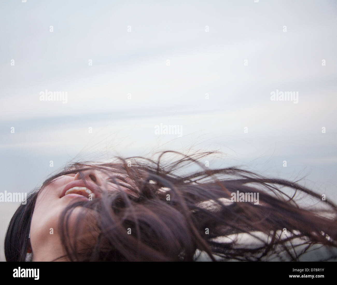 Young woman with hair blowing Stock Photo - Alamy