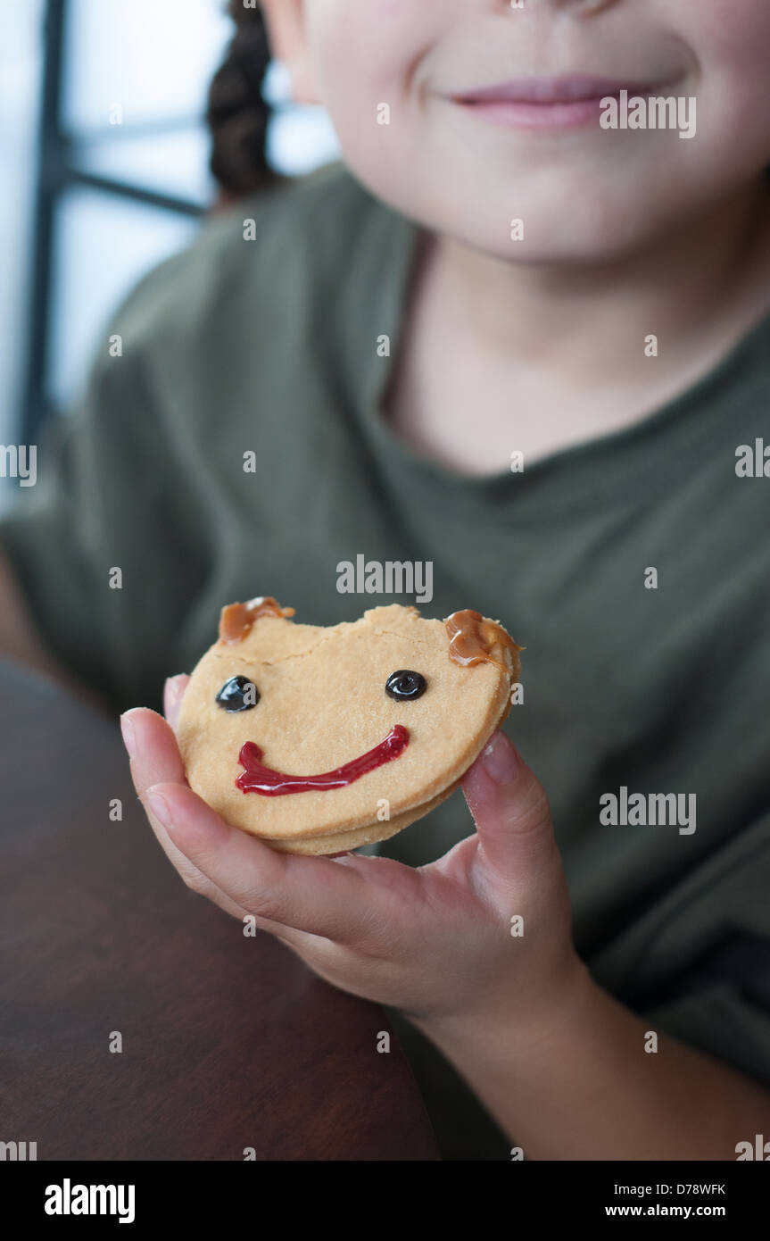 Child eating a cookie Stock Photo