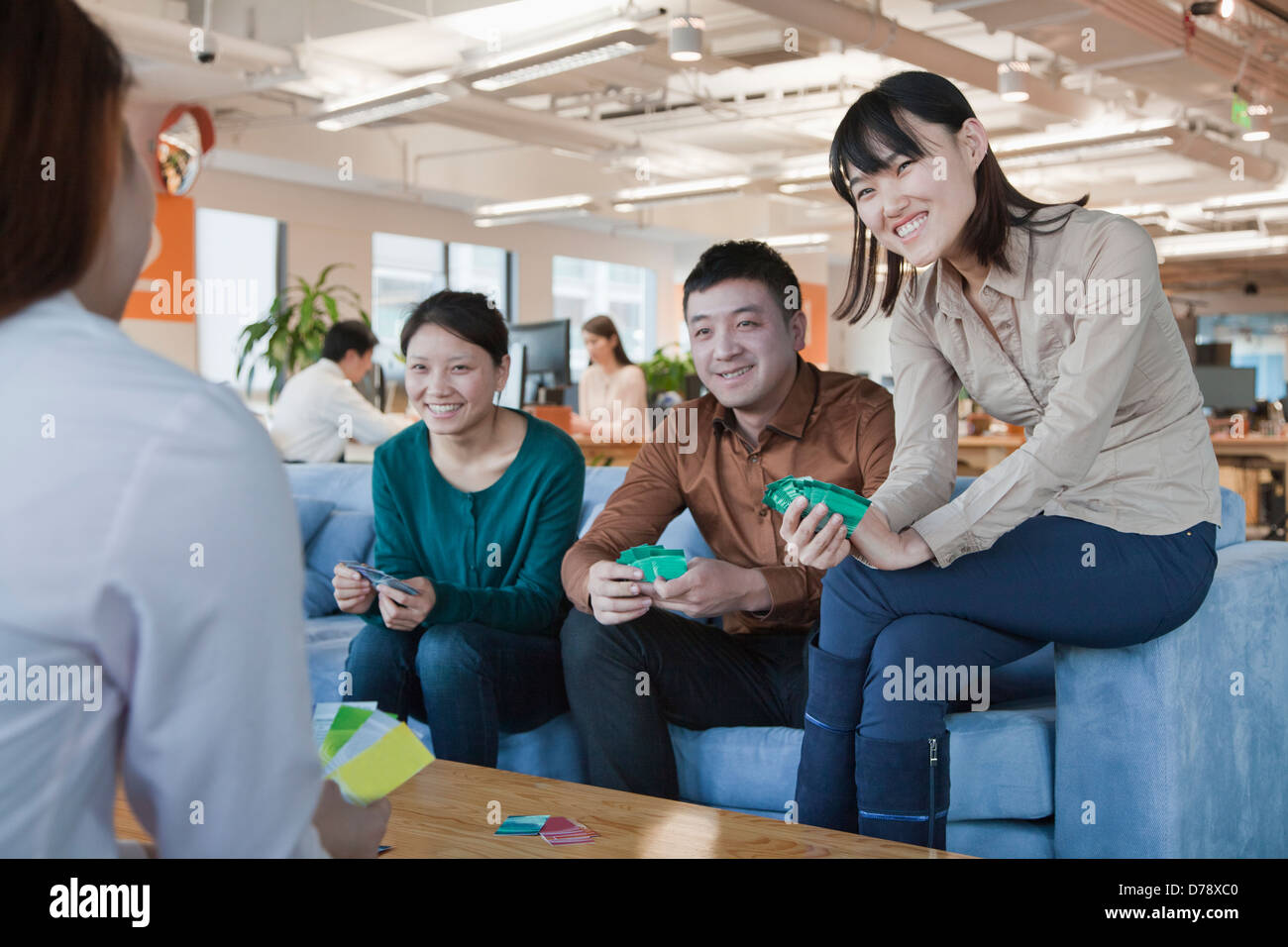 Office Workers Playing Cards in the Office Stock Photo