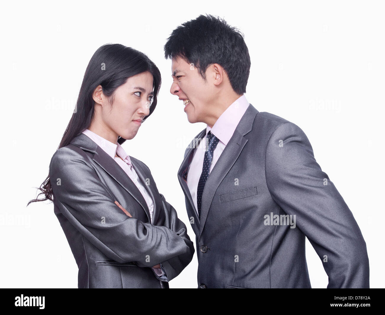 Businessman and businesswoman angry at each other Stock Photo