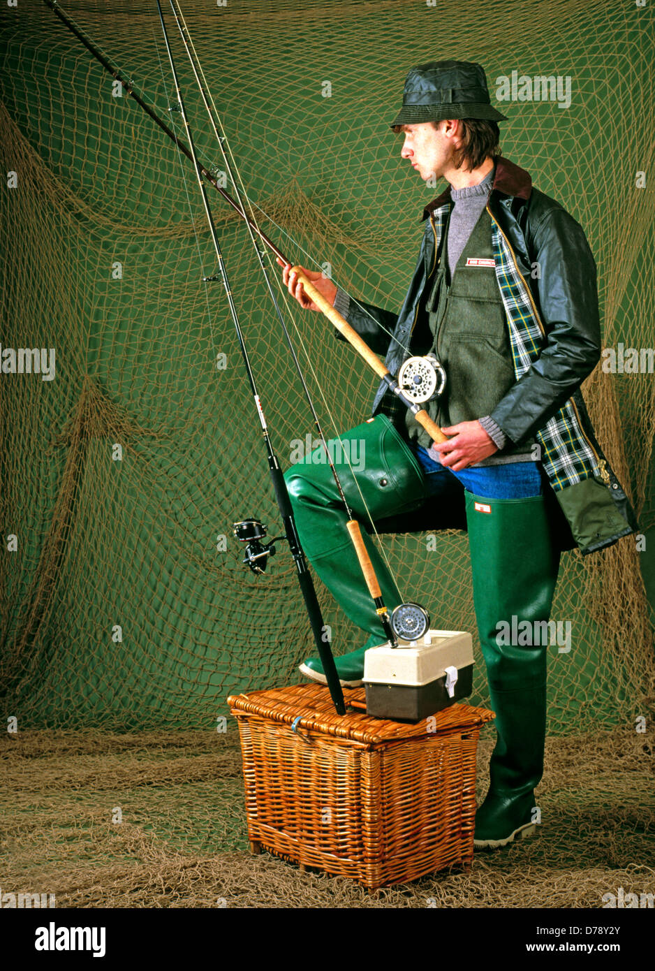 A fully fitted out fly fisher with all his equipment - Ireland Stock Photo