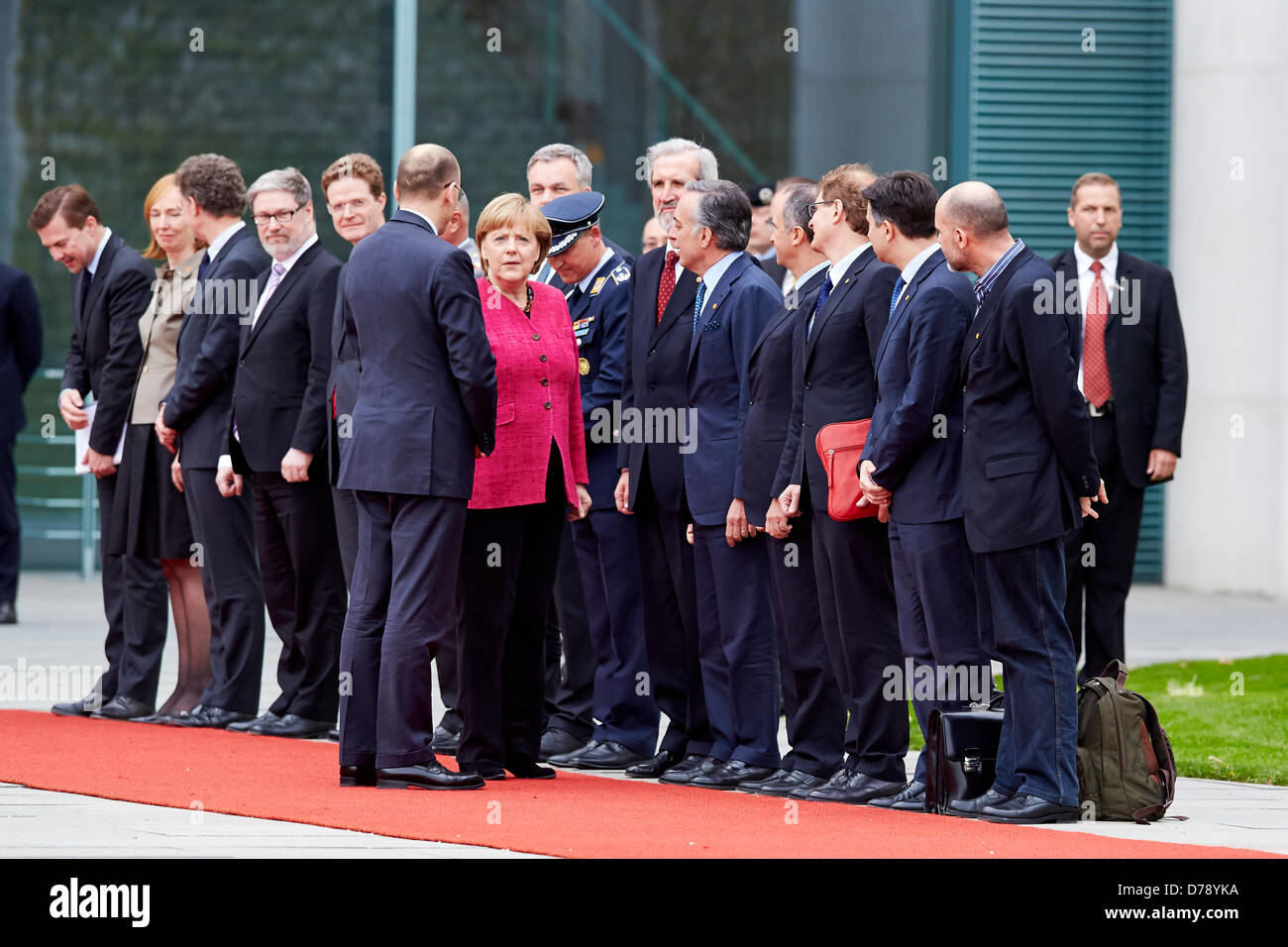 Berlin, Germany. 30th April 2013. Greeting of the Prime Minister of the Italian Republic, Enrico Letta, with military honors by German Chancellor Angela Merkel in the main courtyard of the Federal Chancellery in Berlin. On Picture:  Angela Merkel (CDU), German Chancellor, and Enrico Letta, new Prime Minister of Italia, greats the Federal Ministers fron bouth Country. Credit:  Reynaldo Chaib Paganelli / Alamy Live News Stock Photo